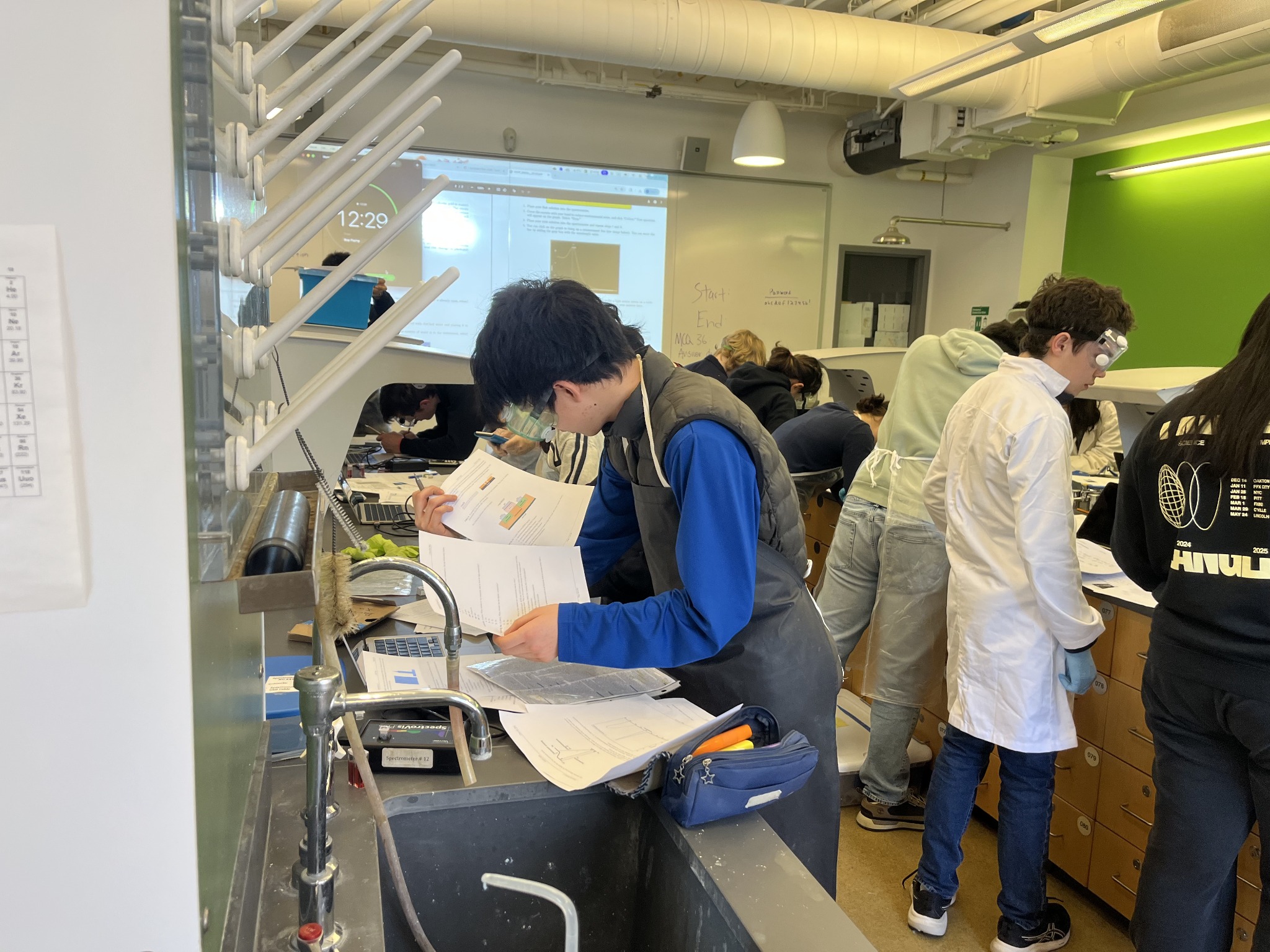 David Xu working at a laboratory bench during the UPenn Invitational